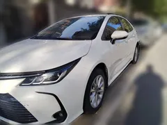 2021 Toyota Corolla 1.2T S-CVT Elite, белый — фото 2