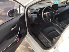 2021 Toyota Corolla Hybrid 1.8L E-CVT Elite, белый — фото 12