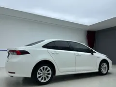 2021 Toyota Corolla Hybrid 1.8L E-CVT Elite, белый — фото 6