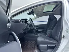 2021 Toyota Corolla Hybrid 1.8L E-CVT Elite, белый — фото 7