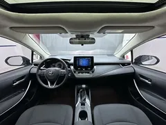 2021 Toyota Corolla Hybrid 1.8L E-CVT Elite, белый — фото 11