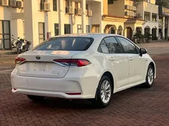 2021 Toyota Corolla Hybrid 1.8L E-CVT Elite, белый — фото 9