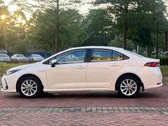 2021 Toyota Corolla Hybrid 1.8L E-CVT Elite, белый — фото 15