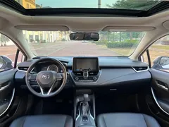 2021 Toyota Corolla Hybrid 1.8L E-CVT Elite, белый — фото 16