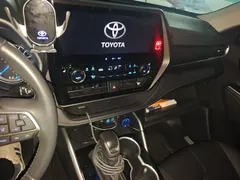2022 Toyota Highlander Hybrid 2.5L 4WD Premium 7-seat, белый — фото 14