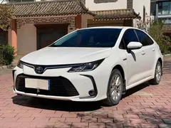 2021 Toyota Corolla Hybrid 1.8L E-CVT Elite, белый — фото 1