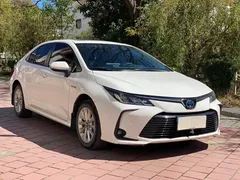 2021 Toyota Corolla Hybrid 1.8L E-CVT Elite, белый — фото 3