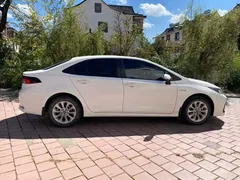 2021 Toyota Corolla Hybrid 1.8L E-CVT Elite, белый — фото 4