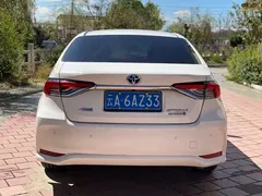 2021 Toyota Corolla Hybrid 1.8L E-CVT Elite, белый — фото 6