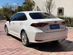 2021 Toyota Corolla Hybrid 1.8L E-CVT Elite, белый — фото 7