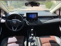 2021 Toyota Corolla Hybrid 1.8L E-CVT Elite, белый — фото 9