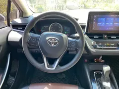 2021 Toyota Corolla Hybrid 1.8L E-CVT Elite, белый — фото 10