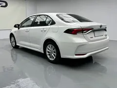 2021 Toyota Corolla Hybrid 1.8L E-CVT Elite, белый — фото 17