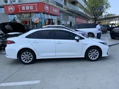 2021 Toyota Corolla Hybrid 1.8L E-CVT Elite, белый — фото 3
