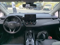 2021 Toyota Corolla Hybrid 1.8L E-CVT Elite, белый — фото 6