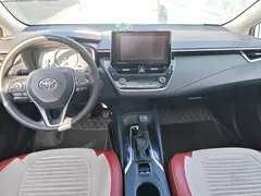 2021 Toyota Corolla Hybrid 1.8L E-CVT Elite, белый — фото 12