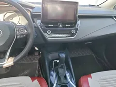 2021 Toyota Corolla Hybrid 1.8L E-CVT Elite, белый — фото 13