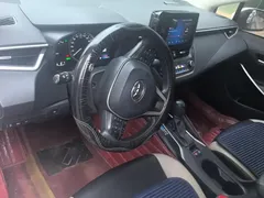 2021 Toyota Corolla Hybrid 1.8L E-CVT Elite, белый — фото 12