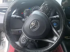 2021 Toyota Corolla Hybrid 1.8L E-CVT Elite, белый — фото 15