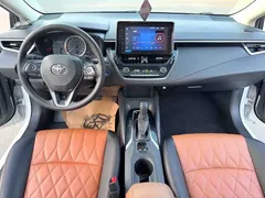 2022 Toyota Corolla 1.8L Hybrid E-CVT, белый — фото 6