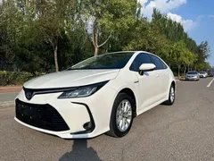 2021 Toyota Corolla Hybrid 1.8L E-CVT Elite, белый — фото 1