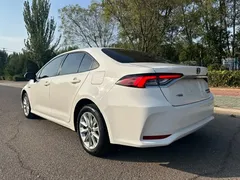 2021 Toyota Corolla Hybrid 1.8L E-CVT Elite, белый — фото 6