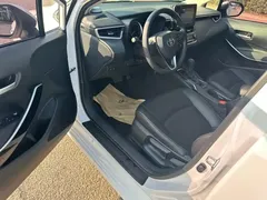 2021 Toyota Corolla Hybrid 1.8L E-CVT Elite, белый — фото 7