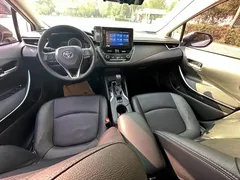 2021 Toyota Corolla Hybrid 1.8L E-CVT Elite, белый — фото 9