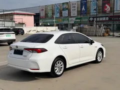 2021 Toyota Corolla Hybrid 1.8L E-CVT Elite, белый — фото 6