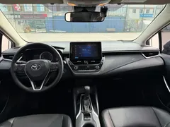 2021 Toyota Corolla Hybrid 1.8L E-CVT Elite, белый — фото 15
