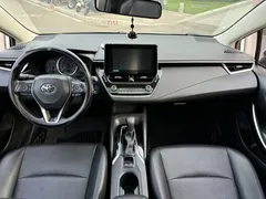 2021 Toyota Corolla Hybrid 1.8L E-CVT Elite, белый — фото 8