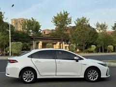 2021 Toyota Corolla Hybrid 1.8L E-CVT Elite, белый — фото 16