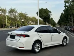 2021 Toyota Corolla Hybrid 1.8L E-CVT Elite, белый — фото 17