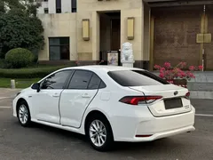 2021 Toyota Corolla Hybrid 1.8L E-CVT Elite, белый — фото 19
