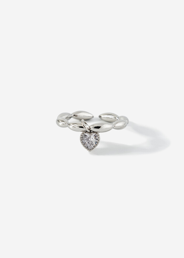 silver ring with a heart pendant