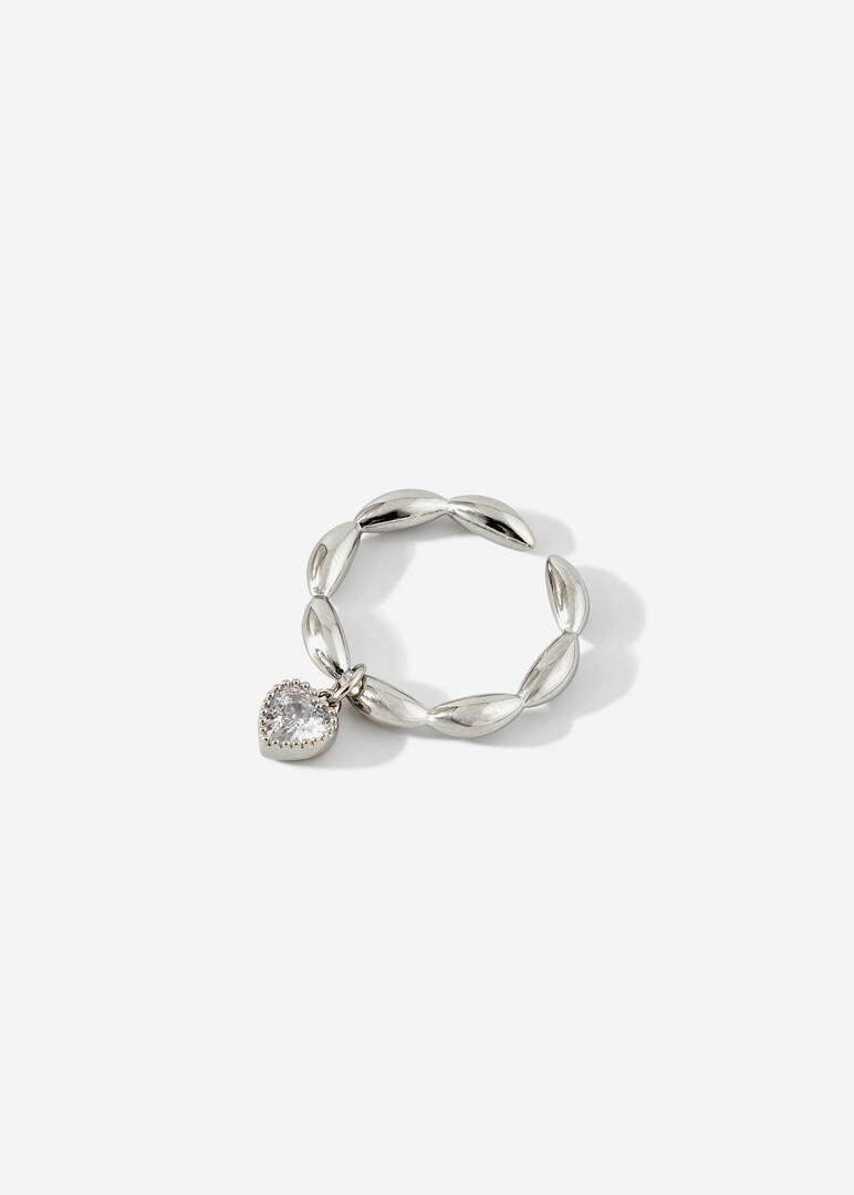 silver ring with a heart pendant