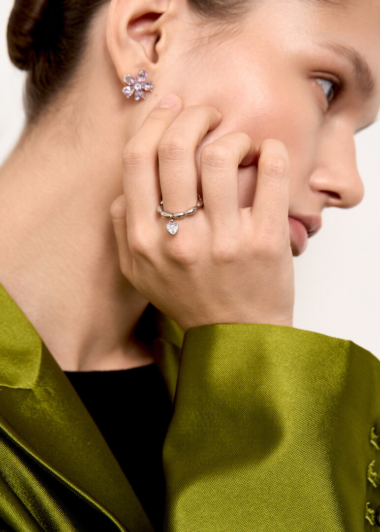 silver ring with a heart pendant