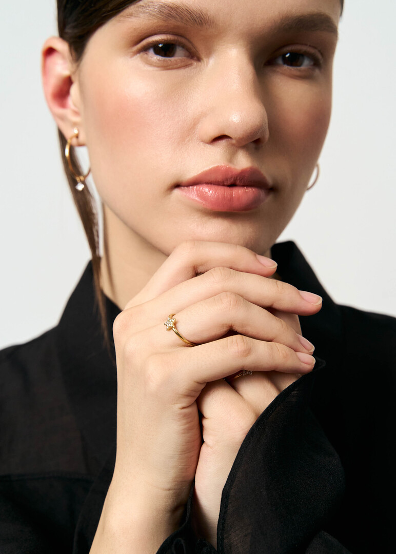 Gold ring with a diamond star.
