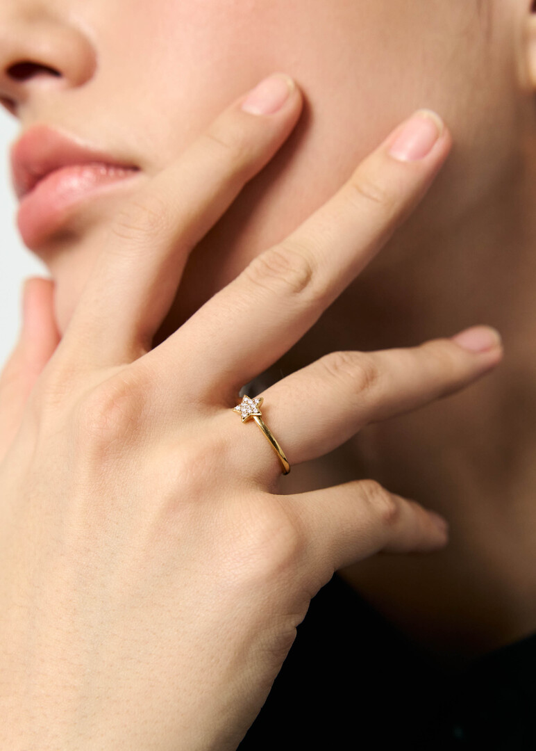 Gold ring with a diamond star.
