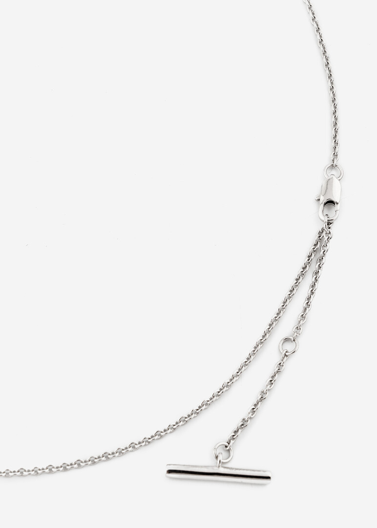 rhodium-plated necklace with a pendant of white crystals