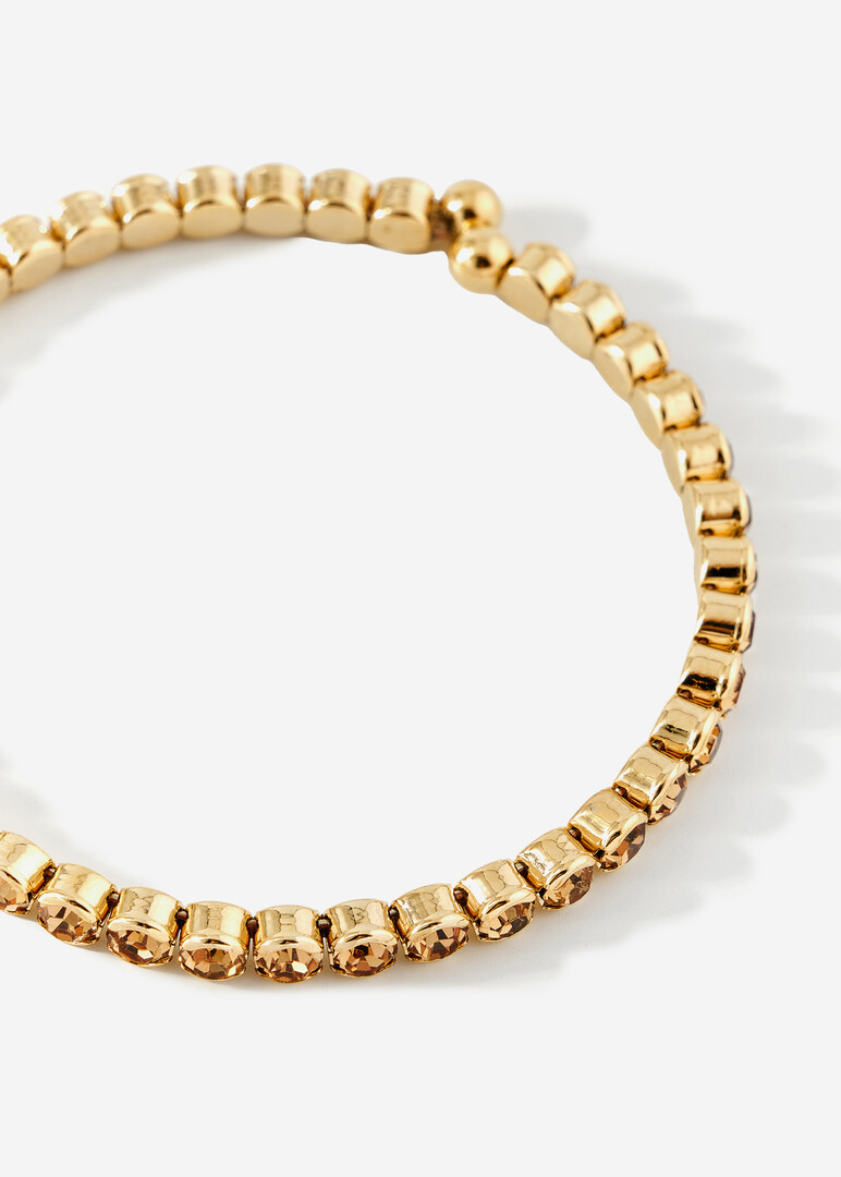 golden bracelet with round crystals