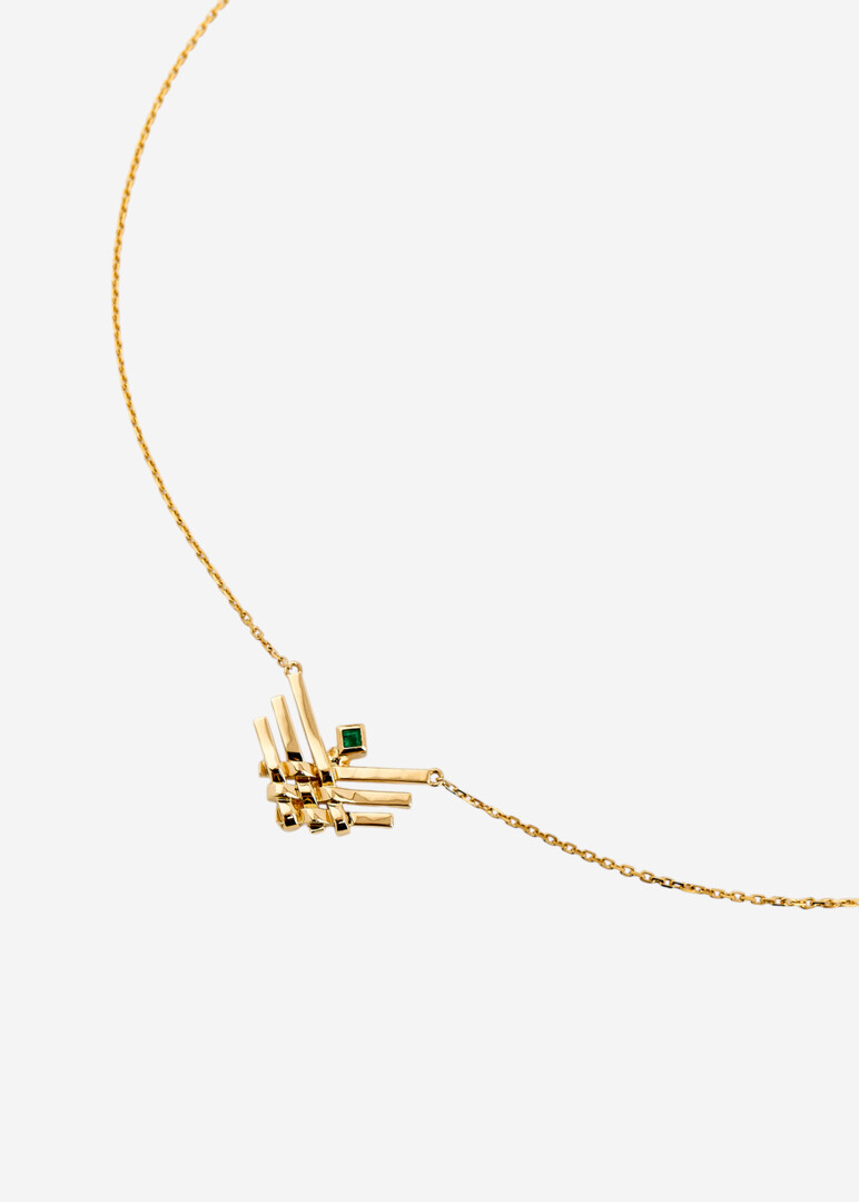 gold pendant on a thin chai