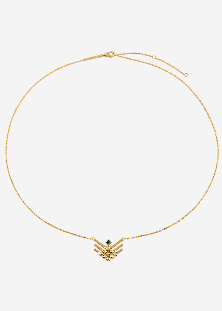gold pendant on a thin chai