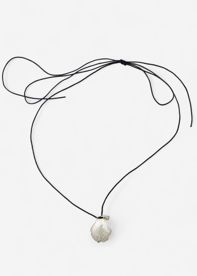 Necklace made of silver with a large seashell on a cord