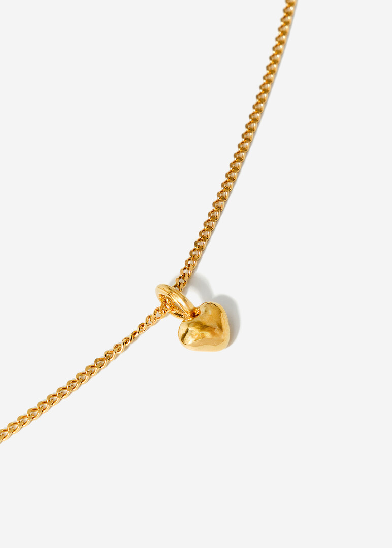 gold plated silver necklace with a small heart