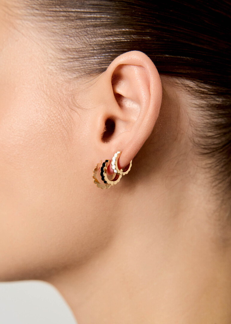 gold Memphis piercing with white enamel