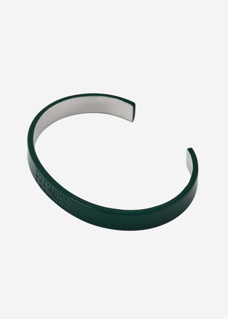 Green bracelet with the brand's logo