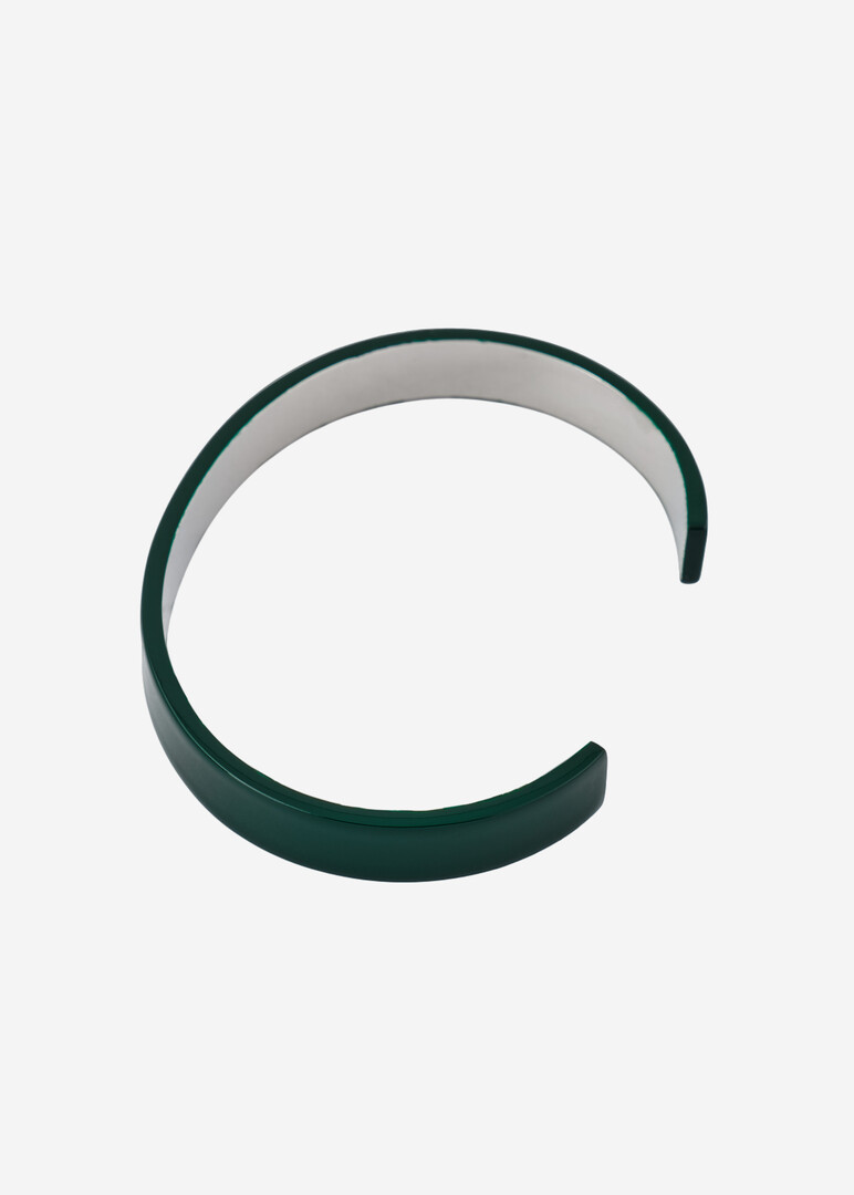 Green bracelet with the brand's logo