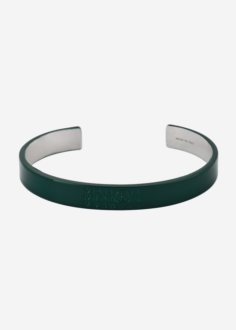 Green bracelet with the brand's logo