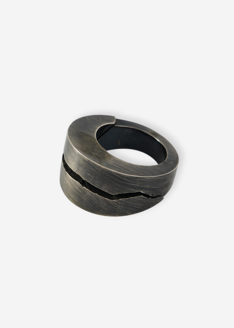 Silver ring with a crack